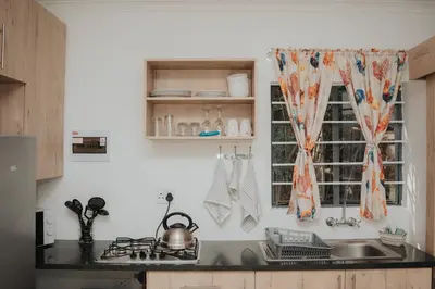 a kitchen with a sink and a window at Pretorius Park in Hartbeespoort
