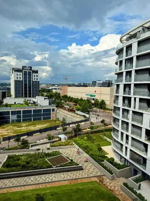 a view of a city with a tall building at Ellipse Waterfall Luxury Sapphire in Midrand