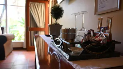 a kitchen counter with a tray of utensils at LUXURY ROOM @ 4 STAR GUEST HOUSE in Middelburg