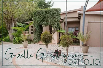 a sign for a house with plants in front of it at 4 Gazelle Guesthouse in Nelspruit