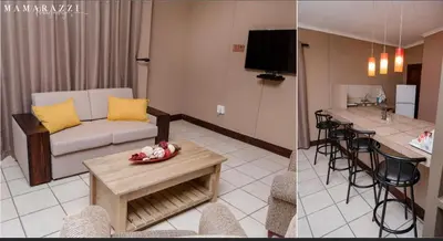 a living room with a couch and a table at 4 Gazelle Guesthouse in Nelspruit