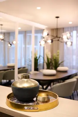 a bowl on a tray on a table in a dining room at Ellipse Waterfall Executive Apartments in Midrand