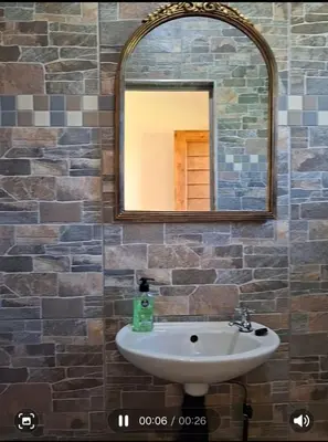 a bathroom with a sink and a mirror at Cosy Beds Web in Witbank