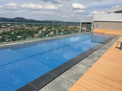 a swimming pool on the roof of a building at Menlyn Maine Trilogy Hotel in Pretoria