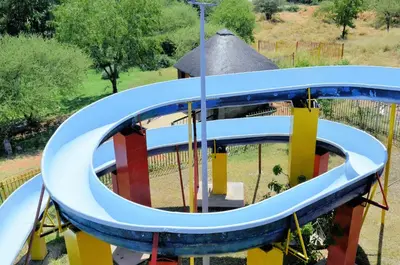 a roundabout at a playground in a park at Sandriver Resort in Musina