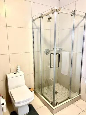 a shower stall in a bathroom with a toilet at Ground Floor Apartment Midrand in Midrand
