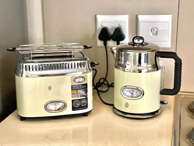 a toaster and blender sitting on a kitchen counter at Ground Floor Apartment Midrand in Midrand