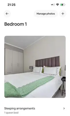 a bedroom with a white bed with a green blanket at Smartz Apartment 334 in Midrand