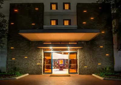 an entrance to a building with a lit up door at The RidgePoint Hotel in Witbank