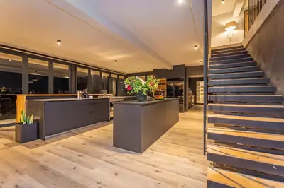 a staircase leading up to a house with a lobby at Misty Meadows in Dullstroom