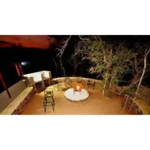 a room with a table and chairs in a room at Mount Marula Game Lodge - Tambotie in Kwarriekraal