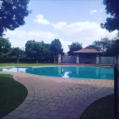 a swimming pool in a yard with a gazebo at Pecanwood Home Away from Home in Hartbeespoort