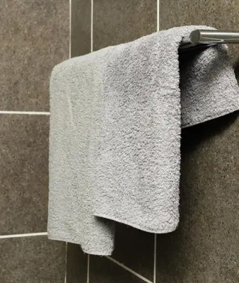 a towel hanging on a towel rack in a bathroom at Honolulu Lifestyle Guest Lodge in Burgersfort