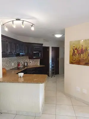 a kitchen with a counter top in a room at Dreamy 3 bedroom villa on the edge of the Sabie River in Kruger Park Lodge in Hazyview