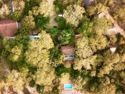 an overhead view of a forest with houses and trees at Zazu Private Bush Lodge, Formerly Masodini in Hoedspruit