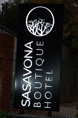 a sign for a restaurant with a sign for aperature at Sasavona Boutique Hotel in Polokwane