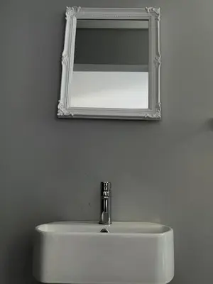 a bathroom sink with a mirror above it at The Lion Mansion - on Solar live and work anywhere in Pretoria
