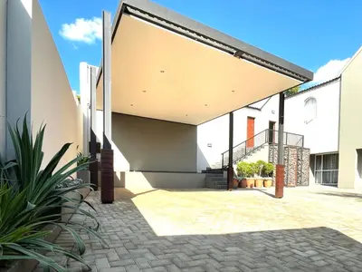 an external view of a house with awning at The Lion Mansion - on Solar live and work anywhere in Pretoria