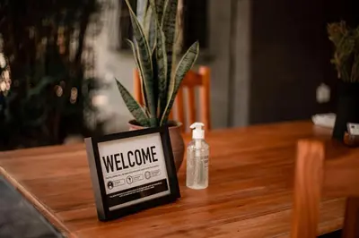 a sign on a table with a bottle of weborne at Linvale Country Lodge in Hazyview