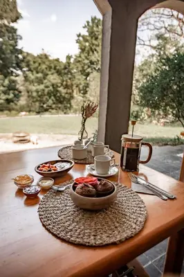 a table with two plates of food on it at Linvale Country Lodge in Hazyview