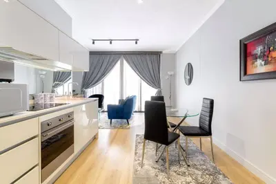 a kitchen and dining room with a table and chairs at Alimama Spaces: The Manson Newton Villa Ellipse in Midrand