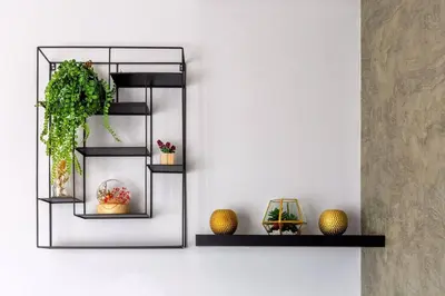 a shelf with plants and vases on a wall at Alimama Spaces: The Manson Newton Villa Ellipse in Midrand