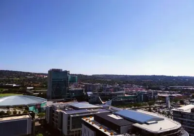 an aerial view of a city with buildings at Menlyn Apartment - Trilogy in Pretoria
