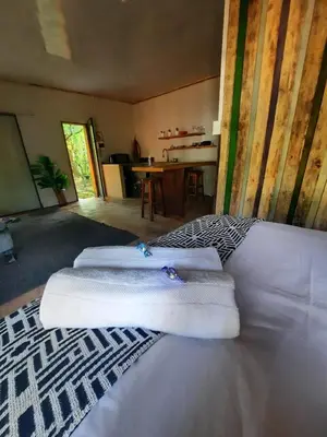 a room with three white towels on top of a bed at Vulture's View 3 in Hartbeespoort
