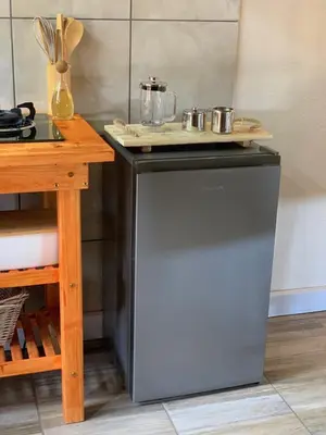 a dishwasher in a kitchen with a counter top at Sunset Guesthouse and Venue Cullinan in Meule
