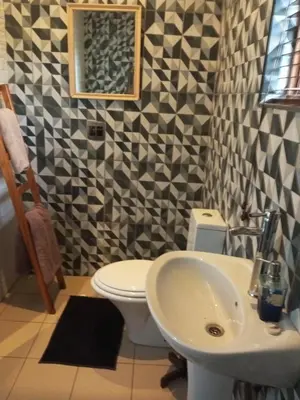 a bathroom with a toilet and a sink at Aloha Menlyn Lodge Ensuite Rooms with shower all with own entrance and unlimited free WiFi in Pretoria