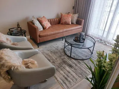 a living room with a couch and a coffee table at 317 Menlyn Maine Trilogy in Pretoria