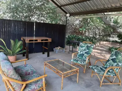 a group of chairs and a table on a patio at In Da Bush in Modimolle