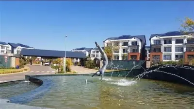 a statue of a bird in a pool of water at The Blyde River Walk Estate in Pretoria