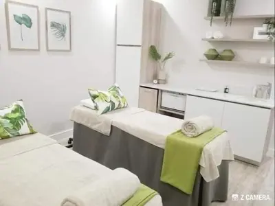 a hospital room with two beds and a sink at The Blyde River Walk Estate in Pretoria