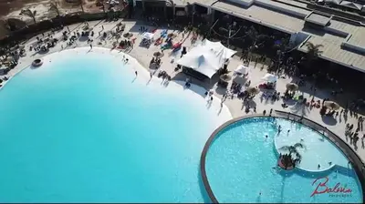 an overhead view of two large swimming pools at The Blyde River Walk Estate in Pretoria