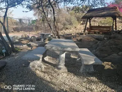 a picnic table and a gazebo in a yard at Private Room Chez Khanyi Homestays in Pretoria
