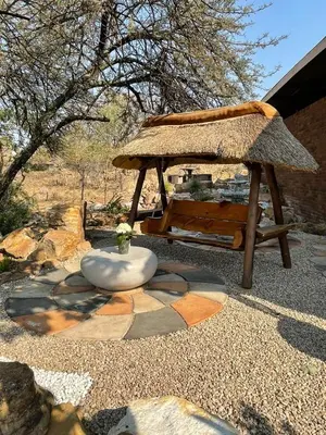 a pavilion with a plant in a bowl on the ground at Private Room Chez Khanyi Homestays in Pretoria