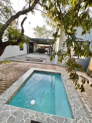 a swimming pool in the backyard of a house at Stories @ Marloth in Marloth Park