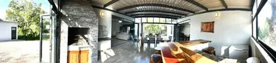 a living room with a fireplace and a couch at Stories @ Marloth in Marloth Park