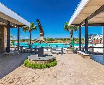 a statue of a giraffe in front of a pool at The Blyde Apartment 1287 in Pretoria