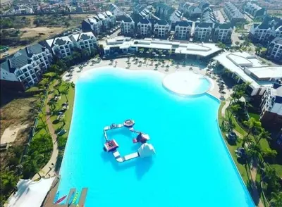 an aerial view of a resort with a large blue lake at The Blyde Apartment 1287 in Pretoria