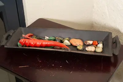 a pan filled with different types of vegetables on a table at HomeSweetHome Farm Cottage in Nelspruit