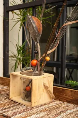 a wooden box with a plant in it on a table at HomeSweetHome Farm Cottage in Nelspruit