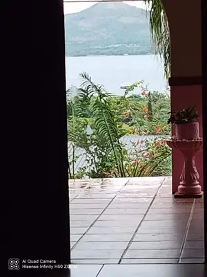 a door to a porch with a view of the water at THEE VIEW in Hartbeespoort