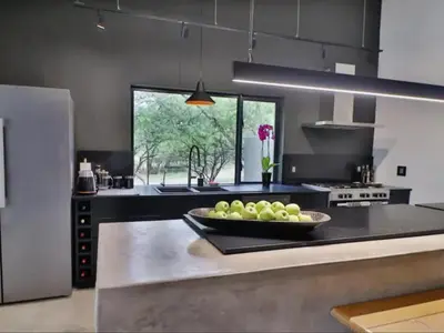 a kitchen with a bowl of fruit on a counter at Chelesa by Kruger Nights in Marloth Park