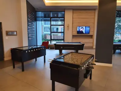 two pool tables in a living room with a tv at Luxury 264 The Blyde in Pretoria