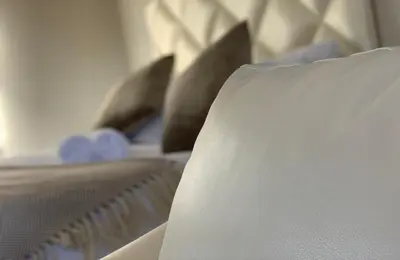a row of pillows sitting on top of a bed at Yami Nawe Lodge in Dennilton
