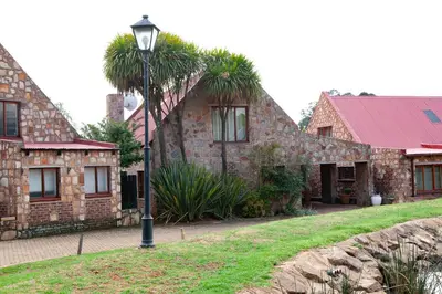 a house with a street light in front of it at Critchley Common in Dullstroom