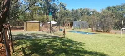 a backyard with a pool with a fence and afficient at Vulture's View 5 in Hartbeespoort