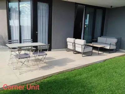 a group of chairs and tables on a patio at Waterfall Luxury Apartment in Midrand